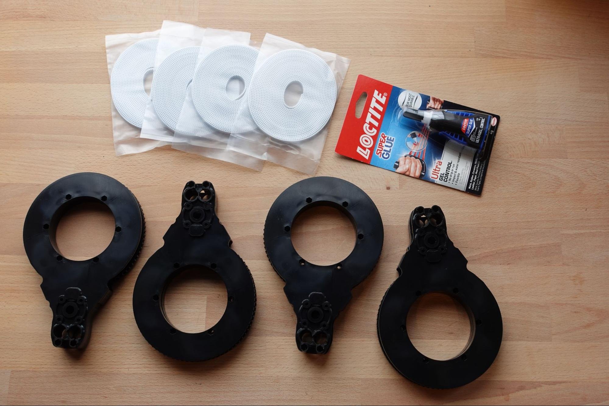 Gathering the belts, arms, and super glue
