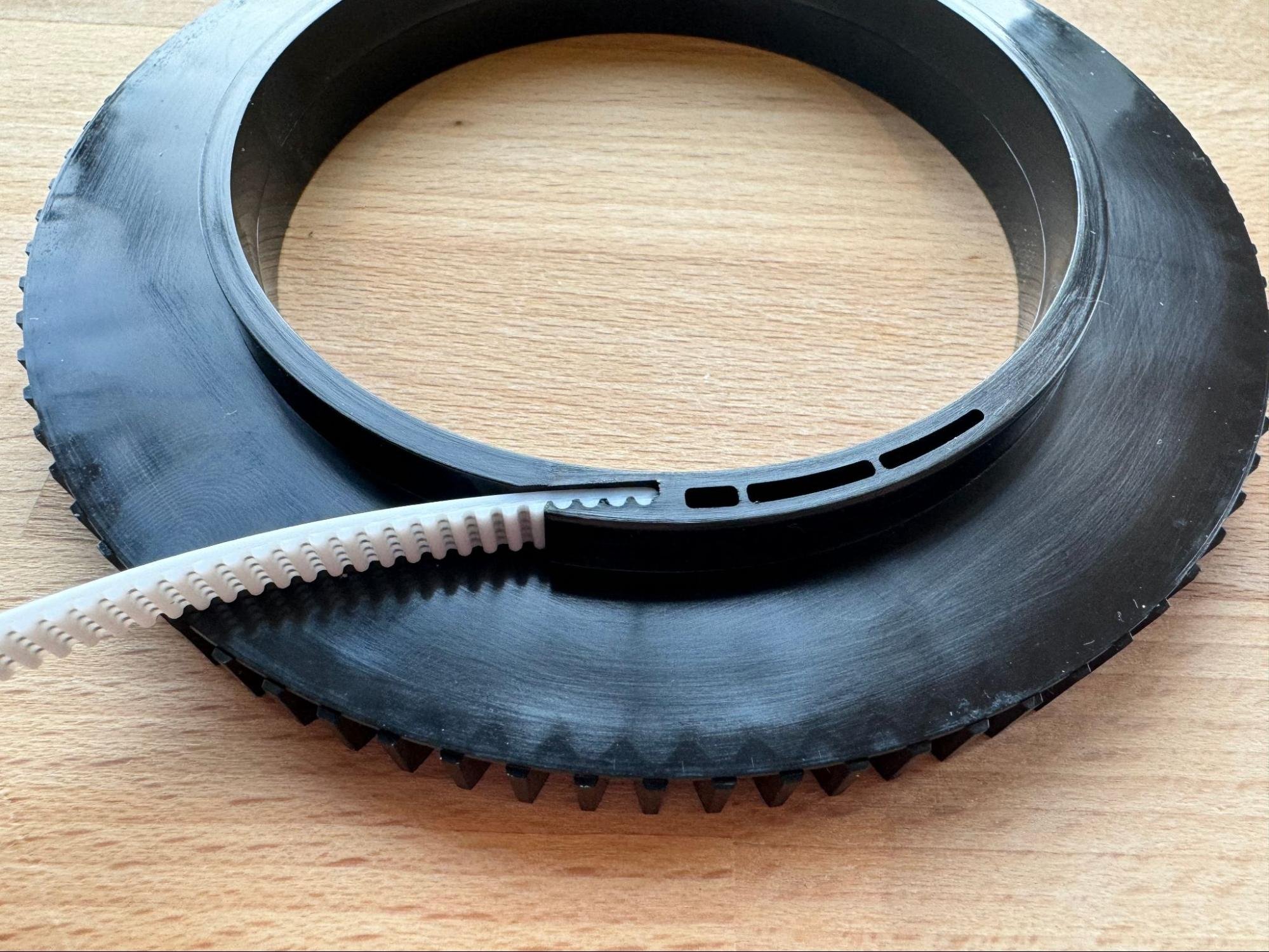 Pressing the belt fully into the slot
