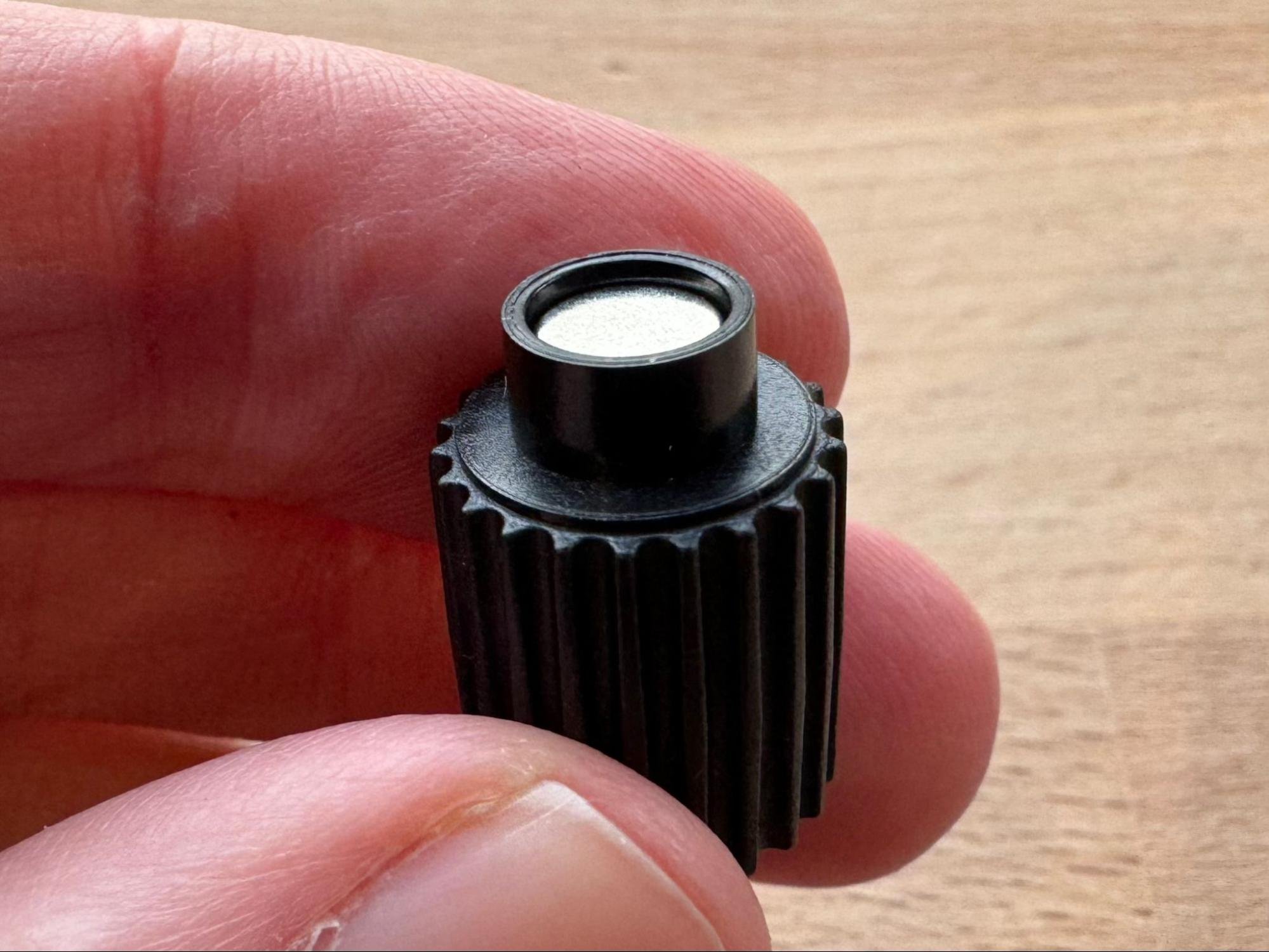 Gluing a magnet into each roller