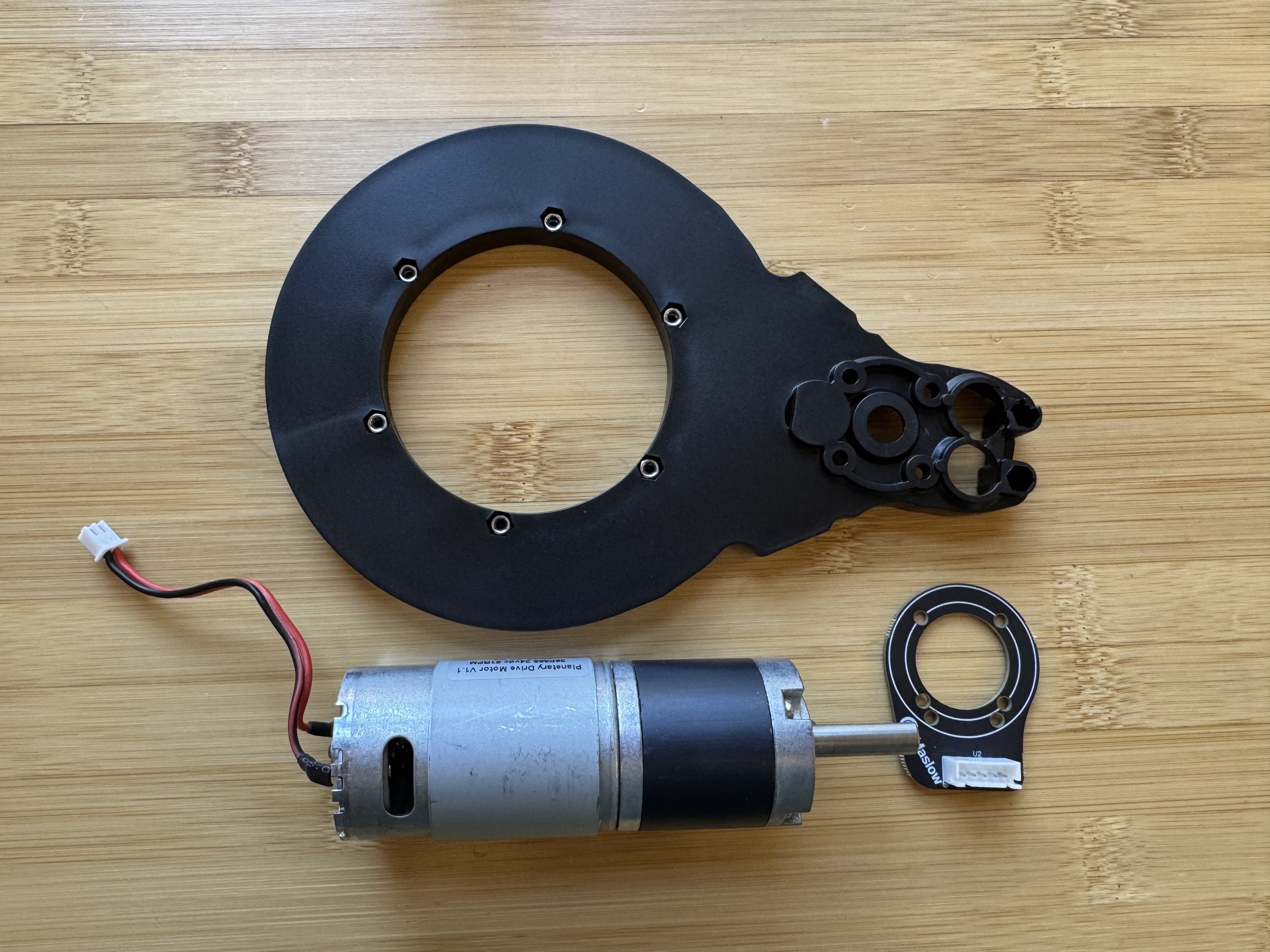 Collecting an arm half, motor, and encoder board