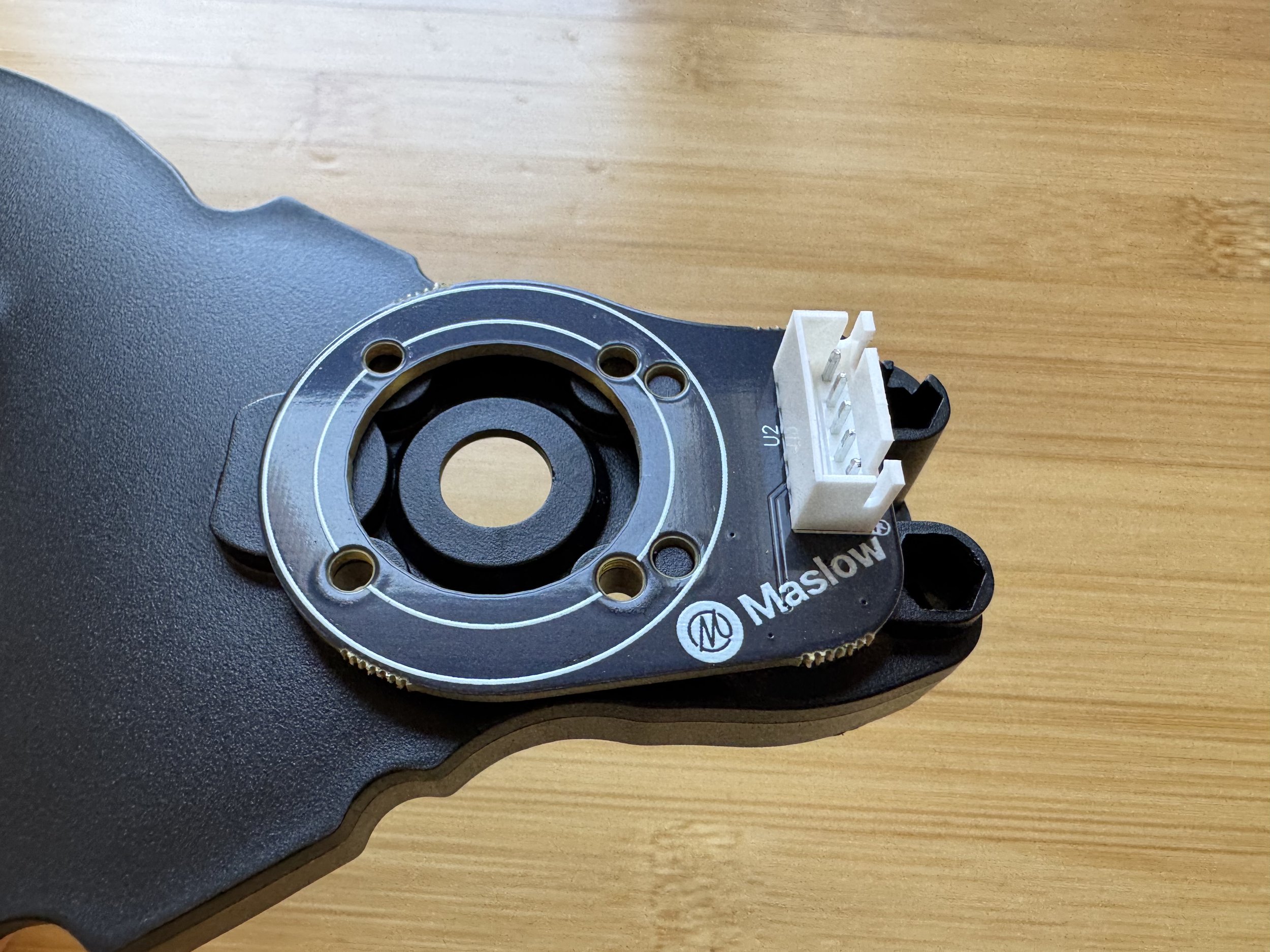 Placing the encoder board over the guide pegs