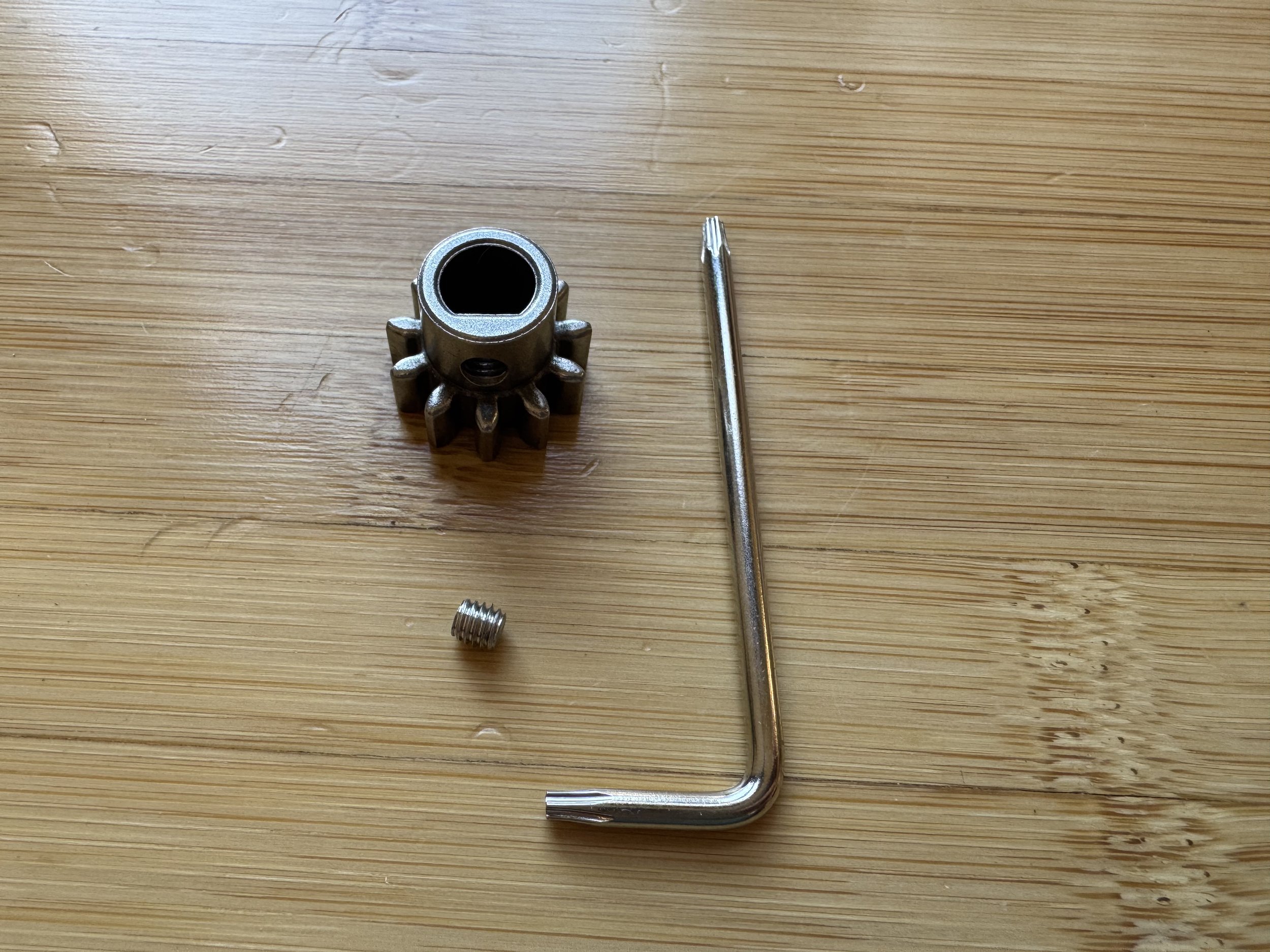 Collecting the drive gear, set screw, and T8 torx wrench