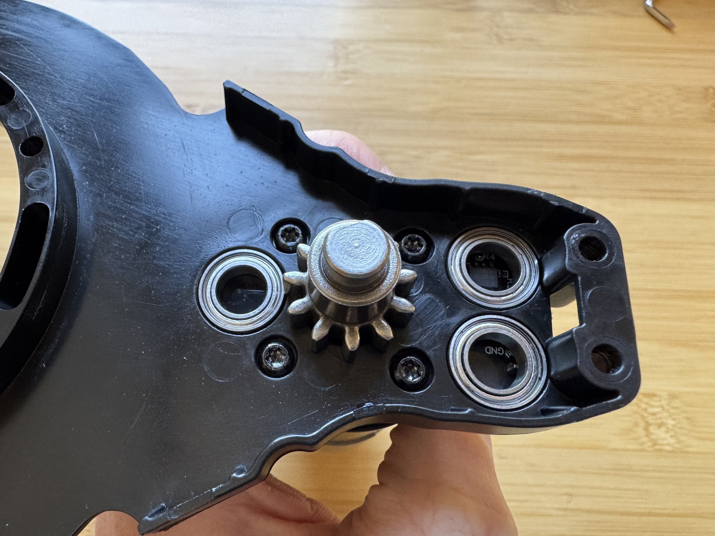 Pressing three bearings into the arm plastic