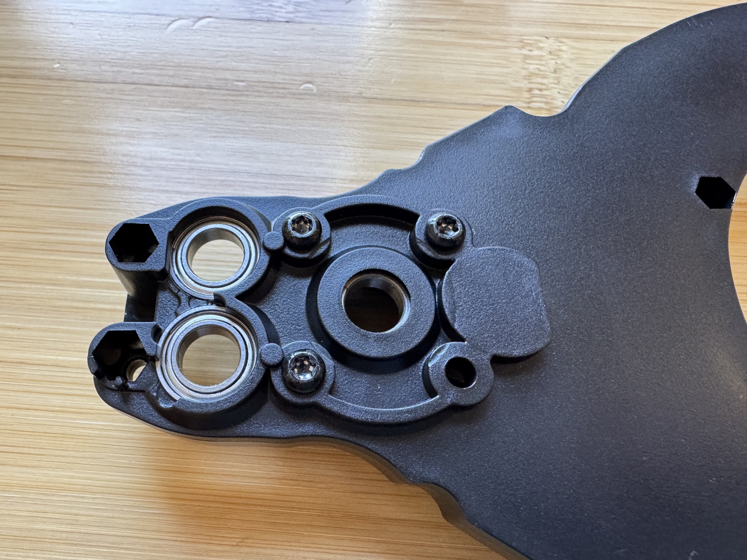 Adding three bolts to hold the belt guard