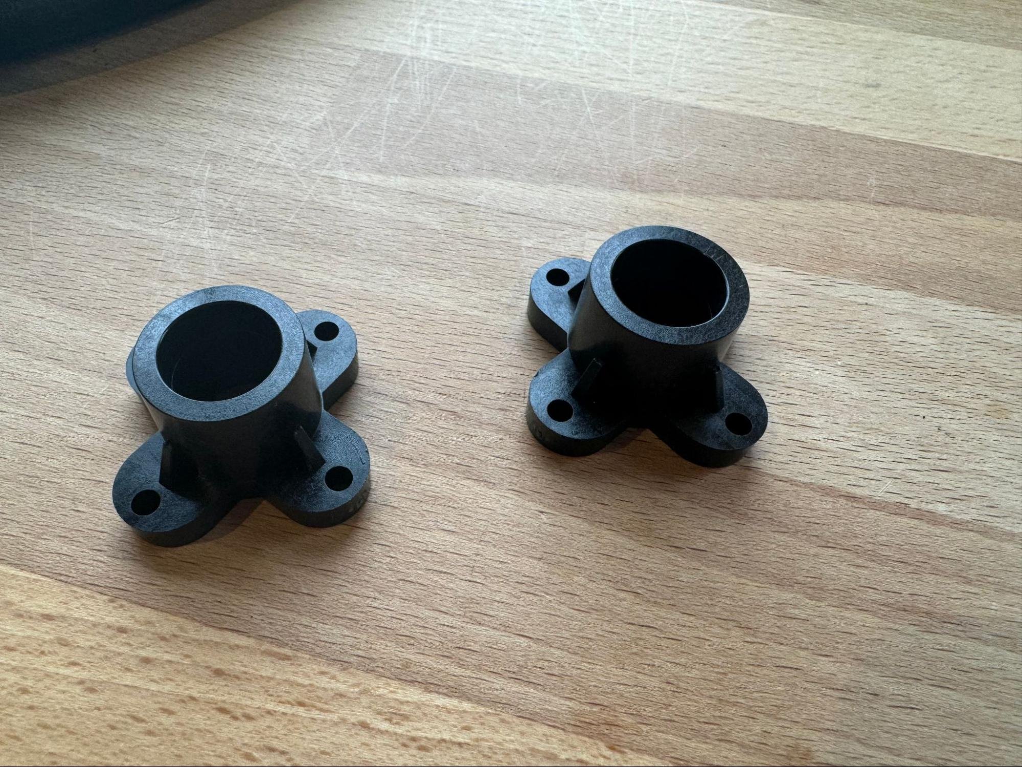 The two linear rod clamps